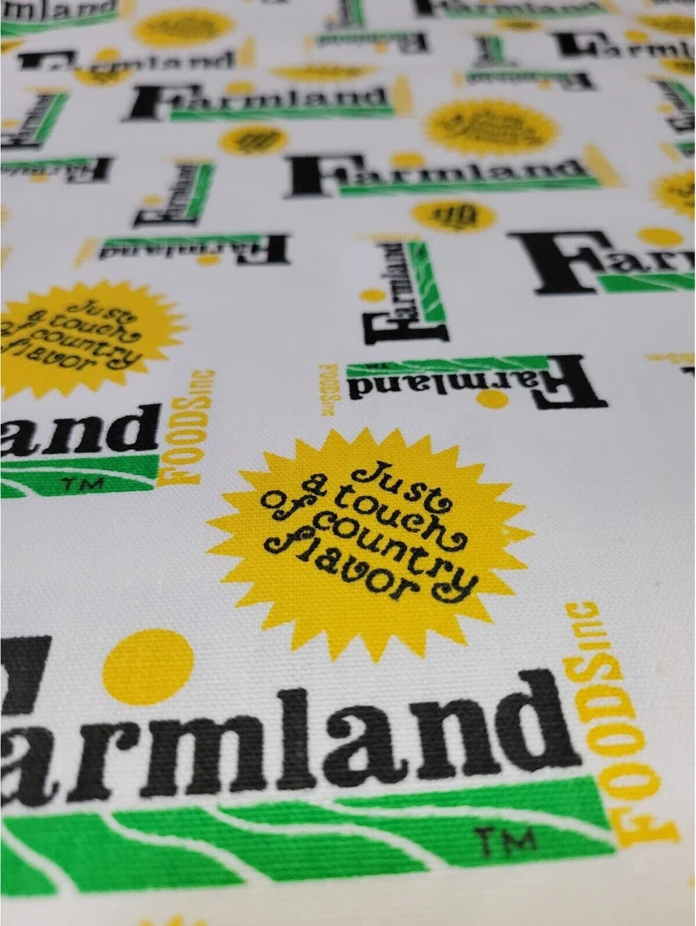 Farmland Cotton Fabric with Yellow and Green Logo Print 1 yard